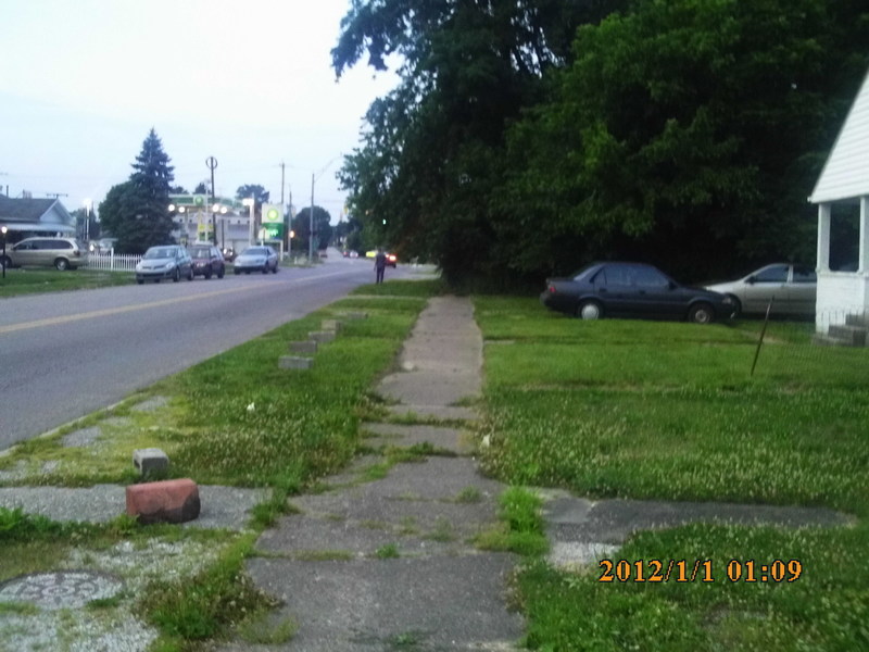 Huntington, WV: huntington city propety not taken care of, man walking in street