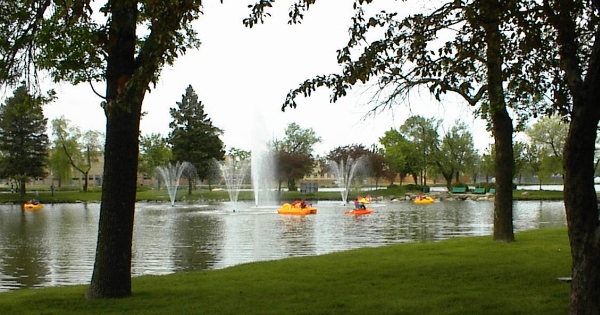 Beloit, WI: View of Lagoon and fountains with recreational paddle boats from Riverside Park on Hwy 51.