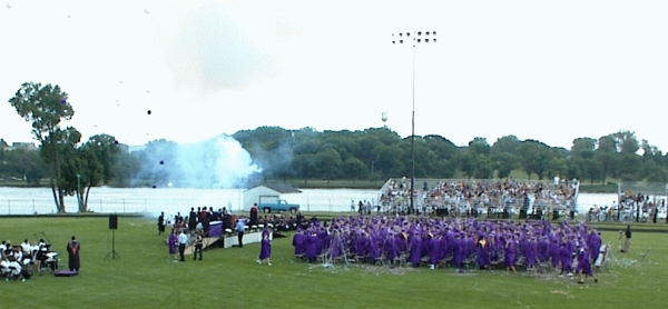 Beloit, WI: Fireworks along the riverbank close the Beloit Memorial High School 2003 Graduation Ceremony.