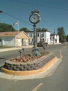 Fowler, MI: Clock and post office down town.