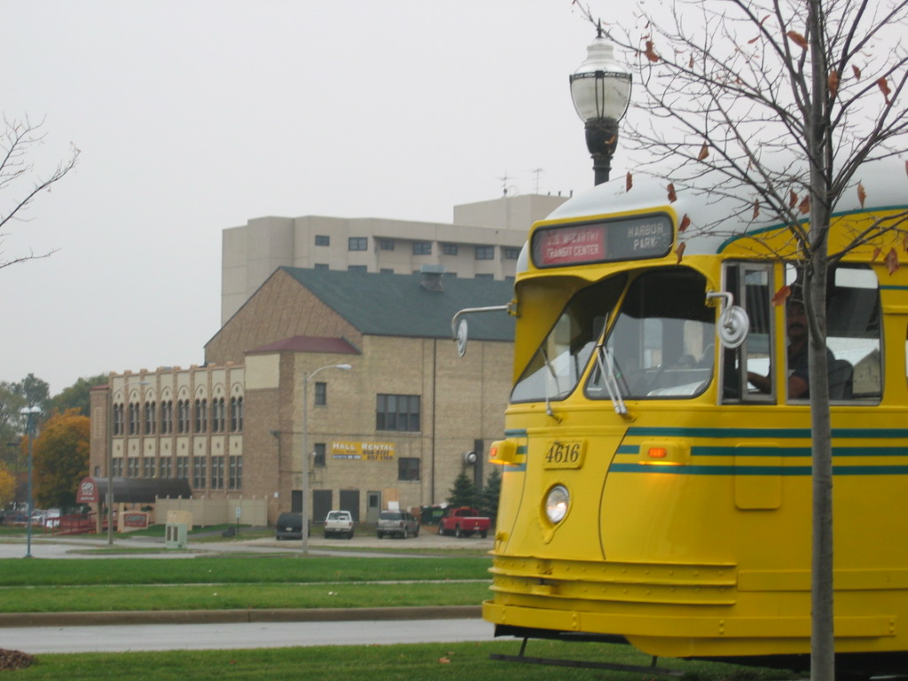Kenosha, WI: Electric Trolley on its rail, the background is the Chops on the Lake, along with the Lakeside Tower Apartments