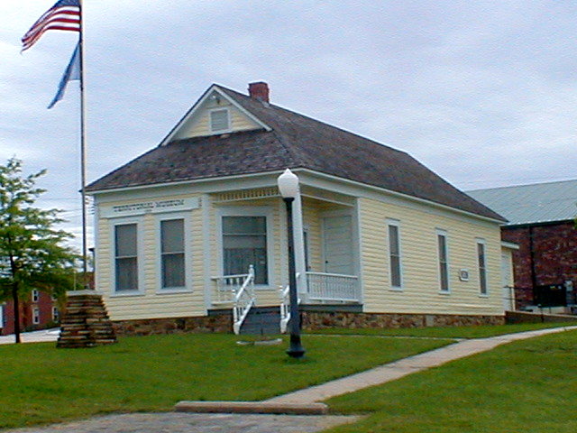 Henryetta, OK: Henryetta Territorial Museum, located in the city's 1905 one-room school. The museum is the home of the Joseph W. Hardin Photography Collection, as well as information on Jim Shoulders, 16 times World Champion Cowboy, coal mining and oil drilling, and has many other interesting area artifacts. Museum hours are 10:00-3:00 Wednesday through Saturday, at 410 West Moore (2 blocks south of Main Street between 4th and 5th). Website: www.territorialmuseum.org.
