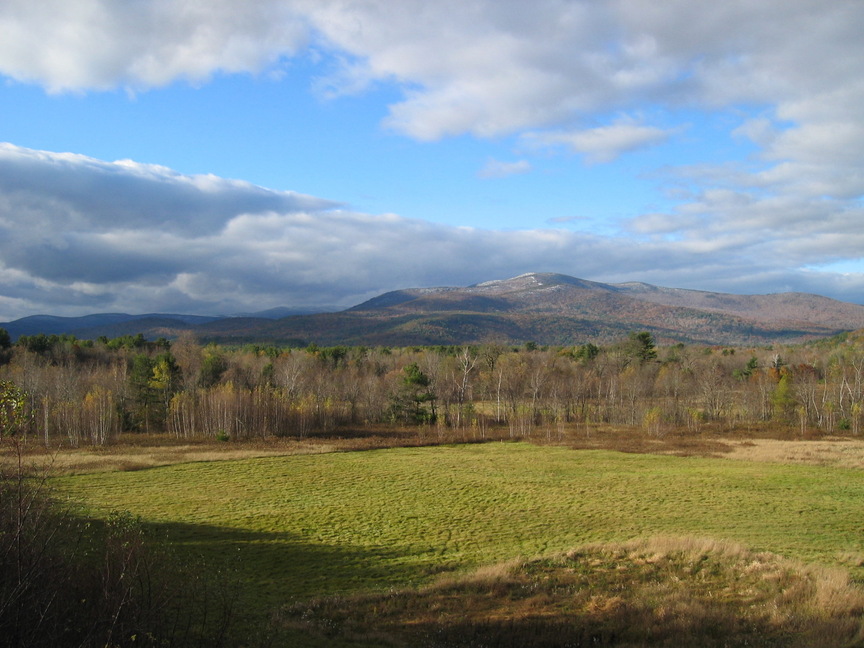 Plymouth, NH: Field & mountains from Tenney Mountain Highway