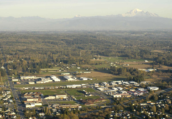 Blaine, WA: Blaine looking east with the K-12 school campus in the lower left and with the Cascades topped by Mt. Baker (R) and Mt. Shuksan in the distance.