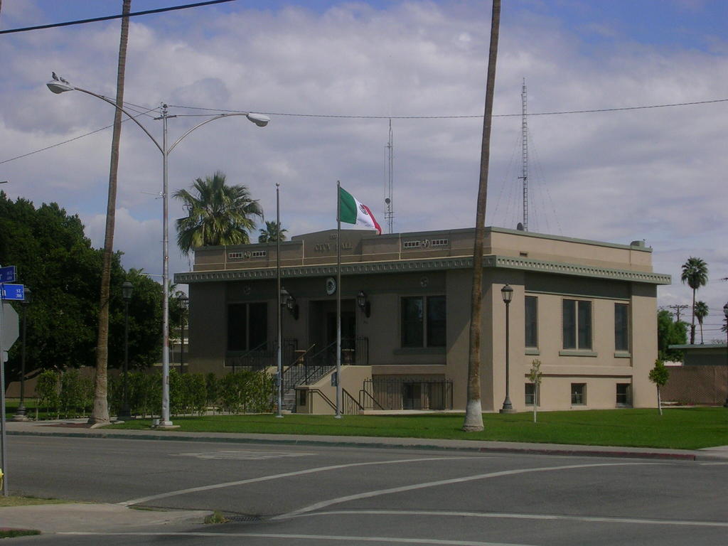 Calexico, CA: Calexico City Hall. I lived in a cabin in Arrowhead which was almost as big as this. Curiously, only the Mexican flag is visible?