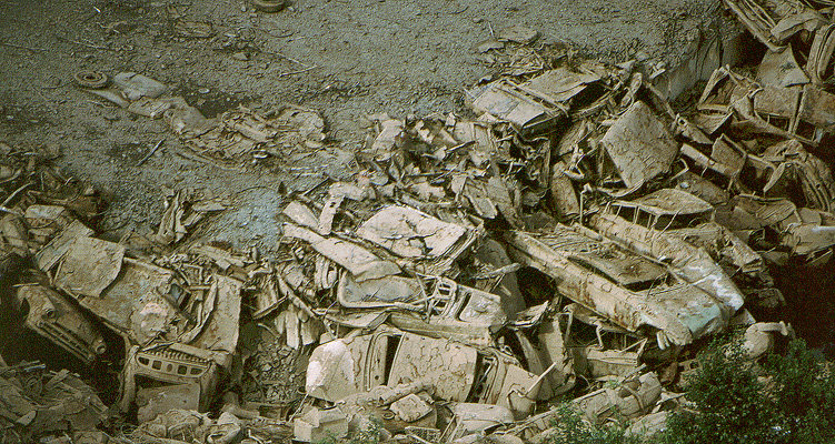 Negaunee, MI: Junk automobiles piled into an old quarry outside of Negaunee, Michigan.