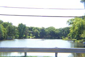 Lake in the Hills, IL: this is a view form the West end (the shallow end) of the lake. When the lake is drawn down, it is here that you can see the top of the wheel from the cart the horses use to pull to dig out the lake.